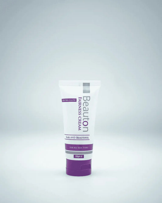 Close-up of Beauton Fairness Cream being applied to skin, showing its smooth texture that targets dark spots and evens skin tone for a luminous glow.