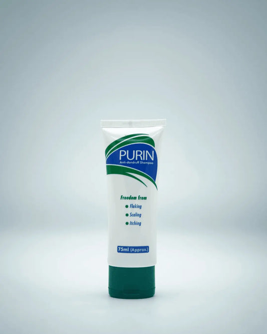 Purin Anti-Dandruff Shampoo bottle, an advanced formula with Selenium Sulphide and Zinc Pyrithione for scalp irritation.