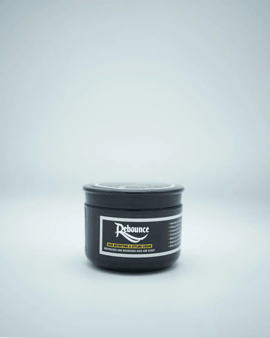 Close-up of Rebounce Hair Cream being applied to hair, showing how it controls frizz, adds shine, and enhances hair texture.